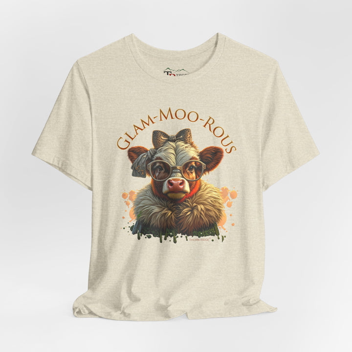 "Glam-Moo-Rous" Graphic Tee with a  Cow in brown tones with sunglasses and bows on her head and a boa around her neck. Labeled Thorn Ridge®