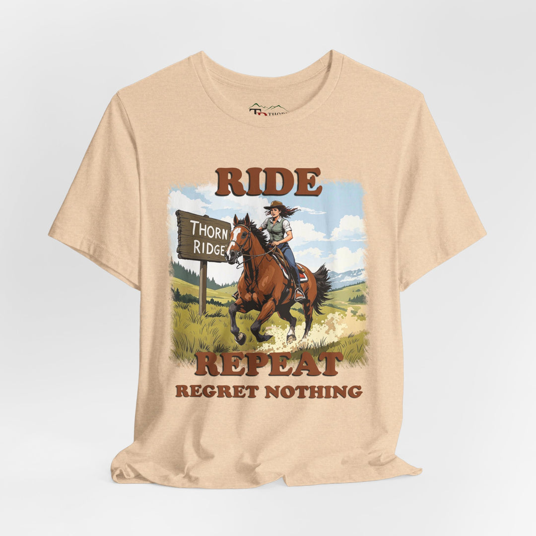 Ride Repeat Regret Nothing tee with a woman riding a galloping horse across the feild with the mountains in the background and a sign labeled Thorn Ridge®
