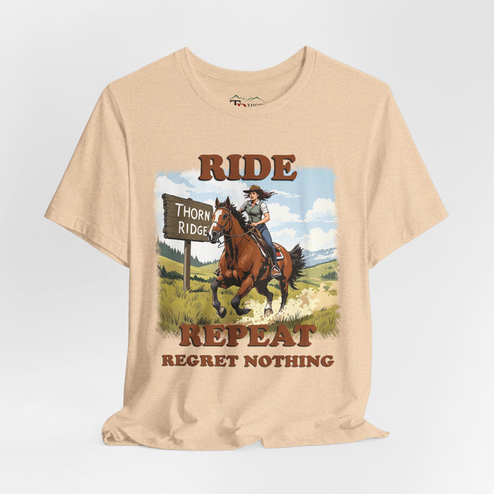 Ride Repeat Regret Nothing tee with a woman riding a galloping horse across the feild with the mountains in the background and a sign labeled Thorn Ridge®