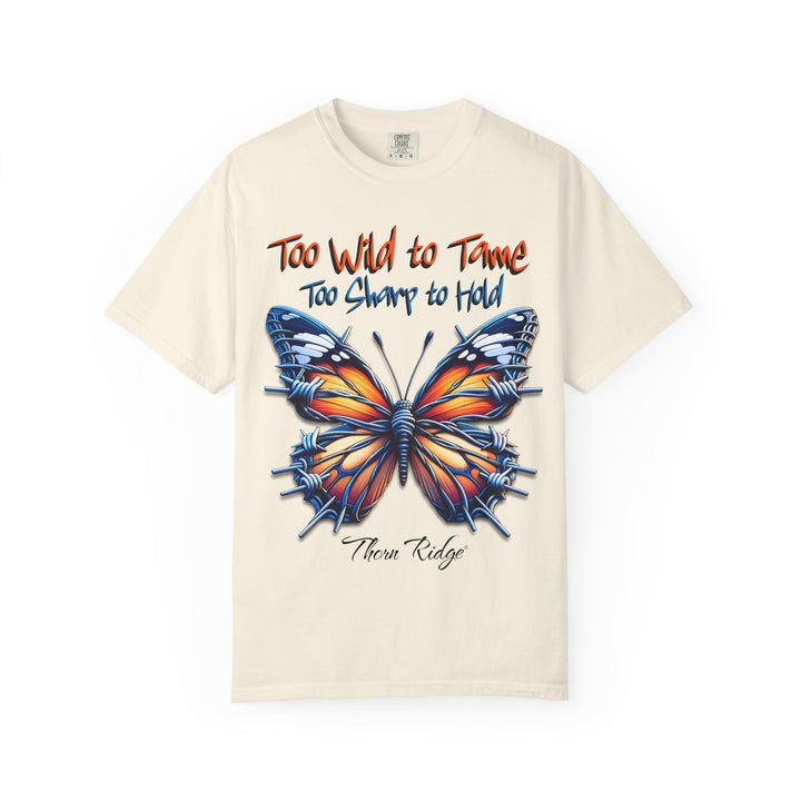 Too Wild To Tame Too Sharp To Hold Graphic Tee with a butterfly with barbed wire wings labeled Thorn Ridge. 