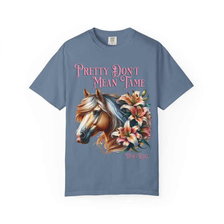 Pretty Don't Mean Tame graphic tee with a horse head and flowers branded to Thorn Ridge®