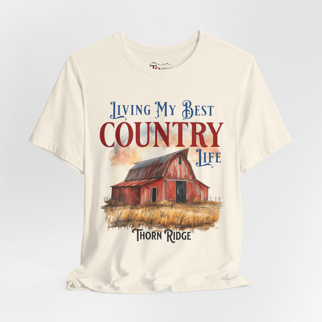 t-shirt with a graphic of a red barn and text 'Living My Best Country Life' branded Thorn Ridge®