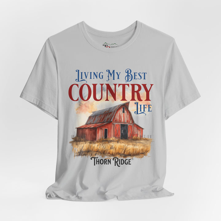 t-shirt with a graphic of a red barn and text 'Living My Best Country Life' branded Thorn Ridge®