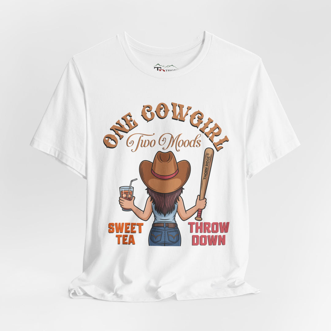 t-shirt with a graphic of a cowgirl holding a drink and a bat, with text 'One Cowgirl Two Moods Sweet Tea Throw Down' labeled Thorn Ridge®