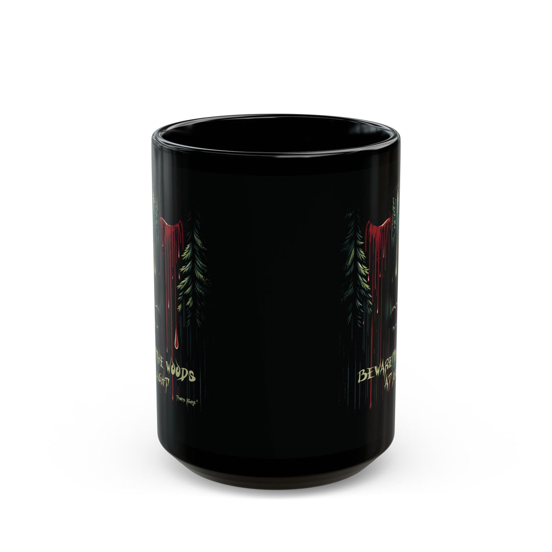 Black mug with a face emerging from the forest with bleeding eyes and a warning Beware the Woods at Night by Thorn Ridge®