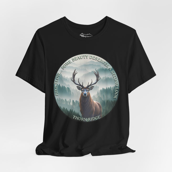 Hike Slow Some Beauty Deserves a Second Look tee with deer and mountains within a circular graphic by Thorn Ridge®