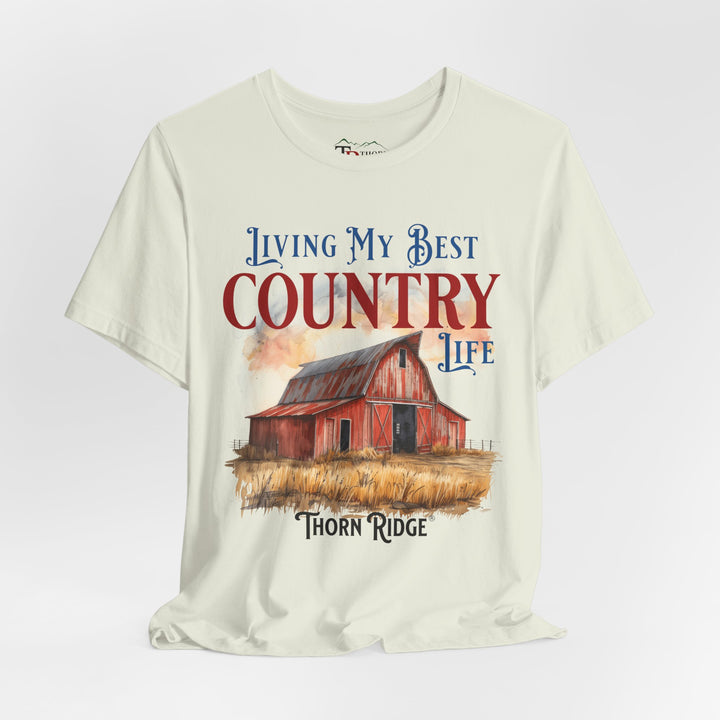 t-shirt with a graphic of a red barn and text 'Living My Best Country Life' branded Thorn Ridge®