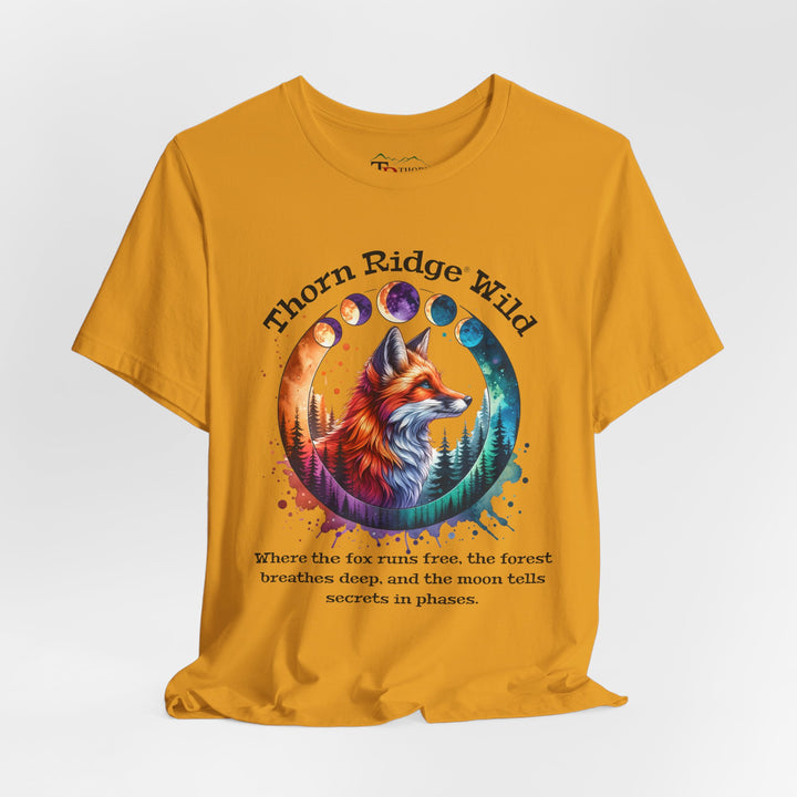 Thorn Ridge Wild Graphic Tee featuring a fox, forest, and moon phases. 