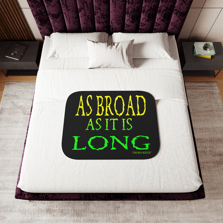 Black sherpa blanket with yellow and green text 'AS BROAD AS IT IS LONG' and 'THORN RIDGE' branding.