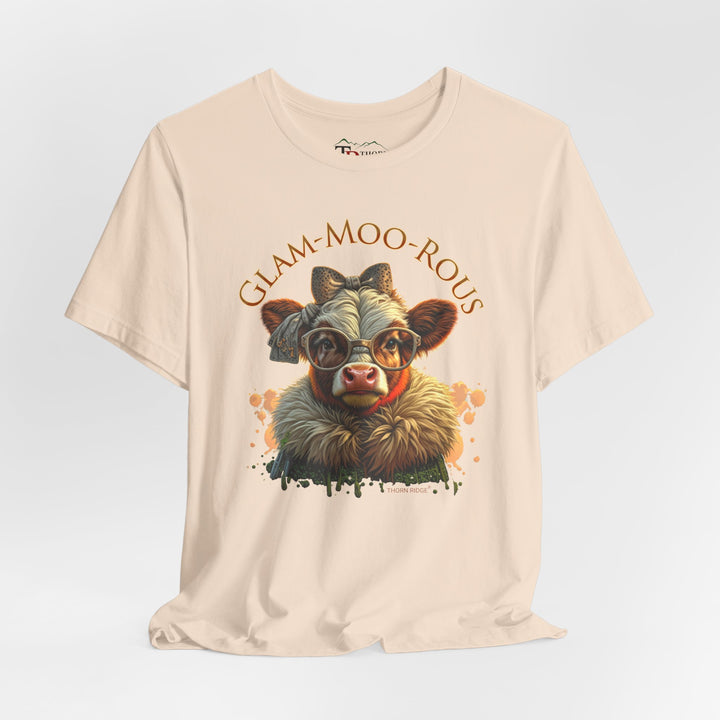 "Glam-Moo-Rous" Graphic Tee with a  Cow in brown tones with sunglasses and bows on her head and a boa around her neck. Labeled Thorn Ridge®