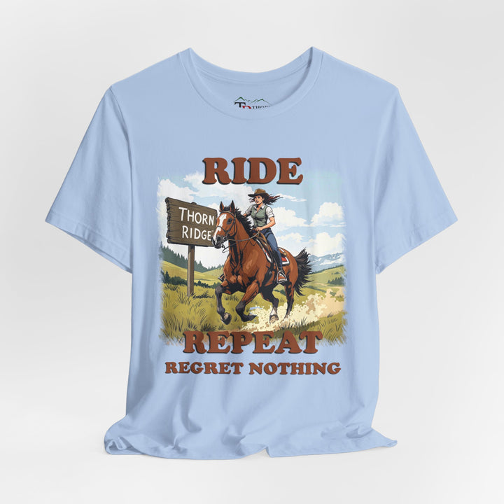 Ride Repeat Regret Nothing tee with a woman riding a galloping horse across the feild with the mountains in the background and a sign labeled Thorn Ridge®