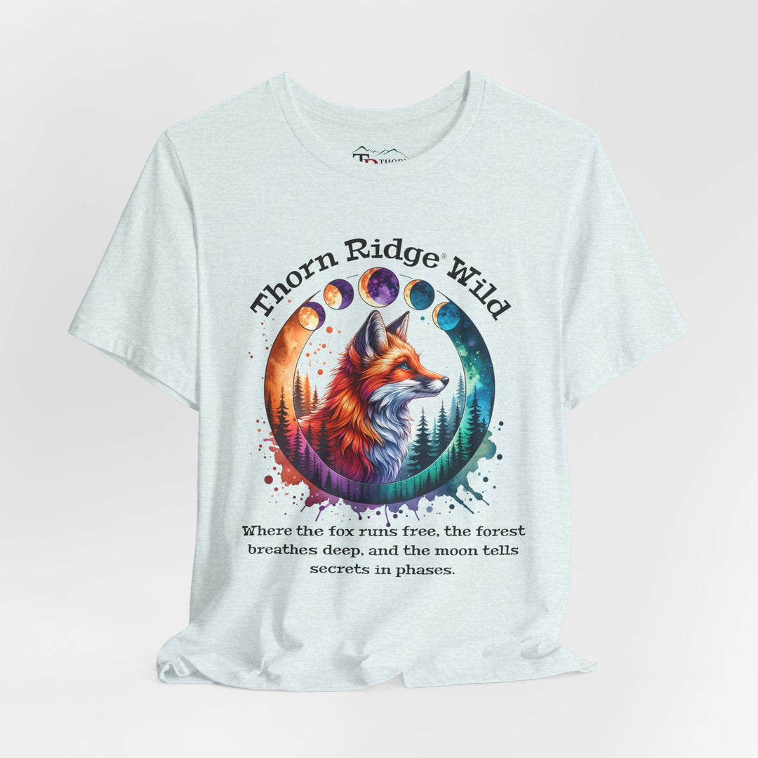 Thorn Ridge Wild Graphic Tee featuring a fox, forest, and moon phases. 