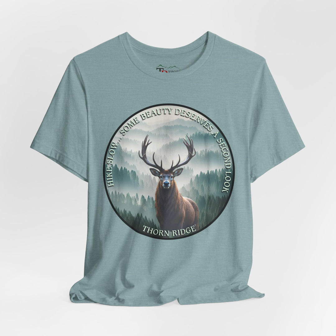 Hike Slow Some Beauty Deserves a Second Look tee with deer and mountains within a circular graphic by Thorn Ridge®