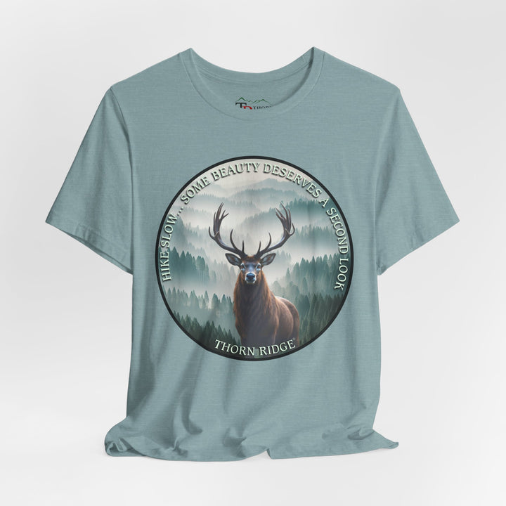 Hike Slow Some Beauty Deserves a Second Look tee with deer and mountains within a circular graphic by Thorn Ridge®