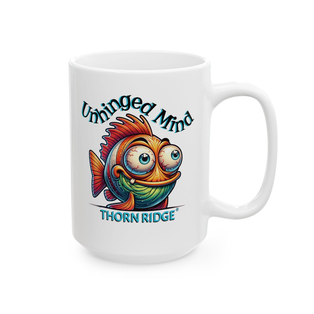 White mug with a colorful fish graphic and Unhinged Mind by Thorn Ridge®