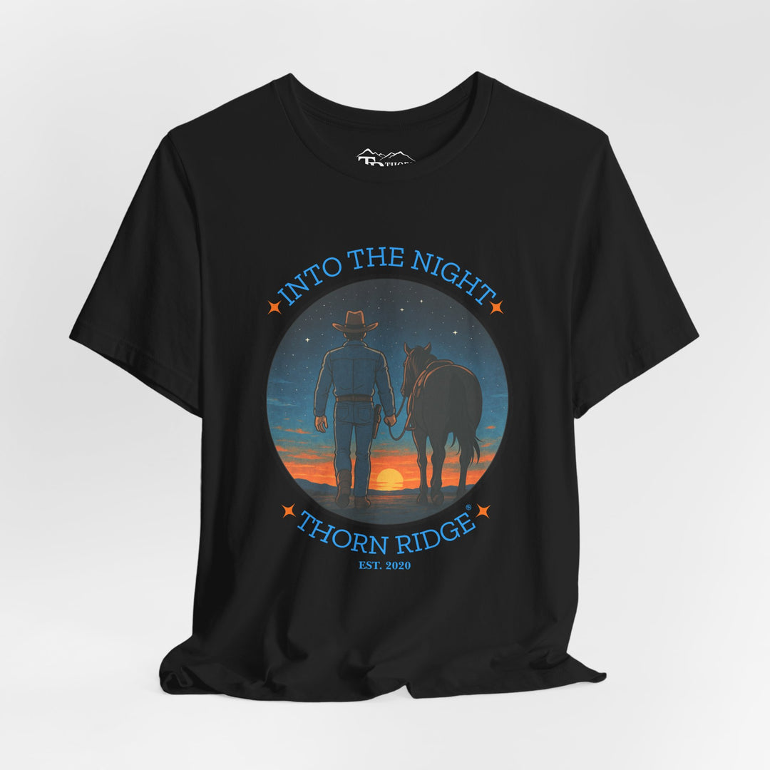 t-shirt with 'Into the Night' and 'Thorn Ridge' graphic design of a cowboy leading his horse into the setting sun as night is falling.