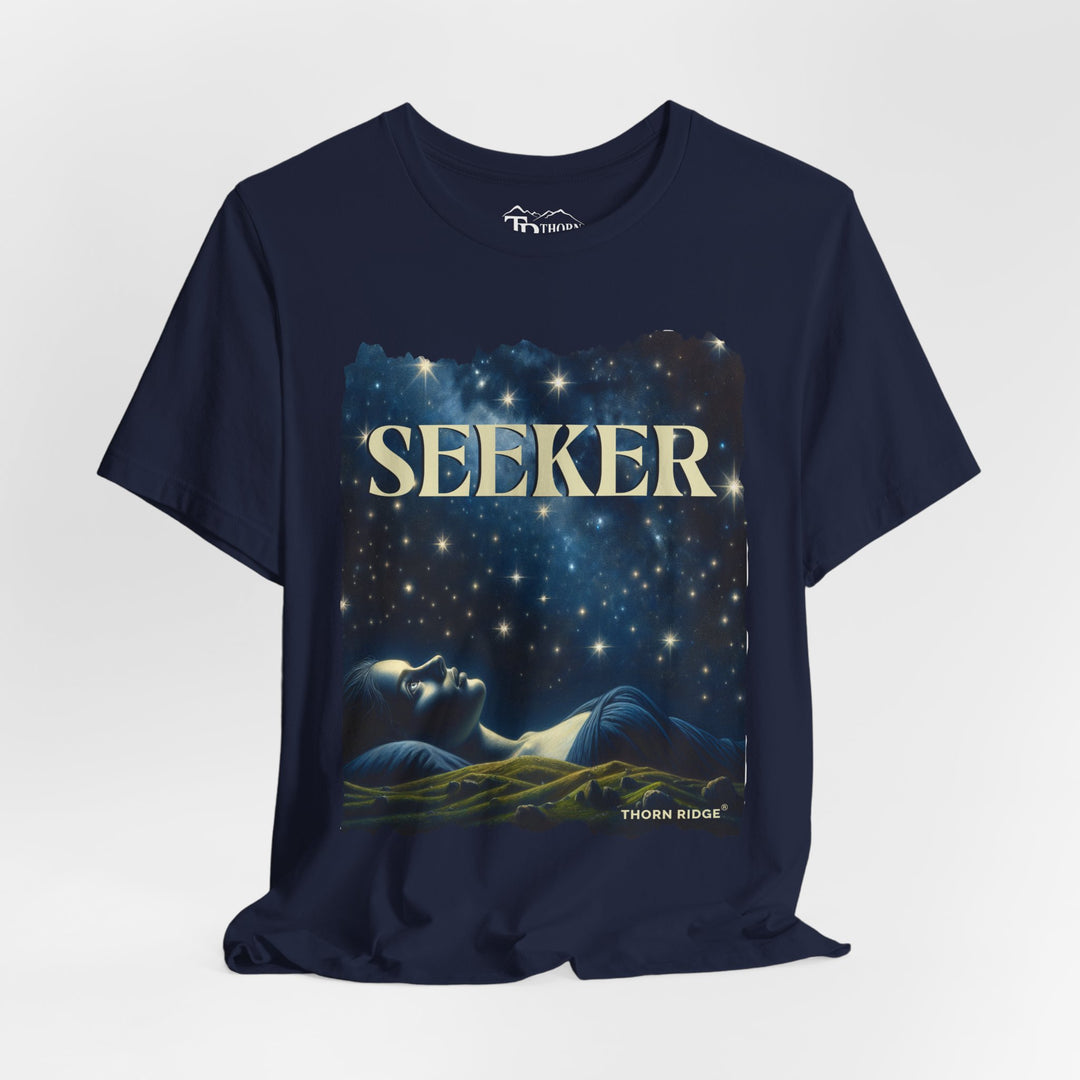 t-shirt labeled Seeker with the graphic of a woman laying on her back looking at the stars labeled Thorn Ridge®