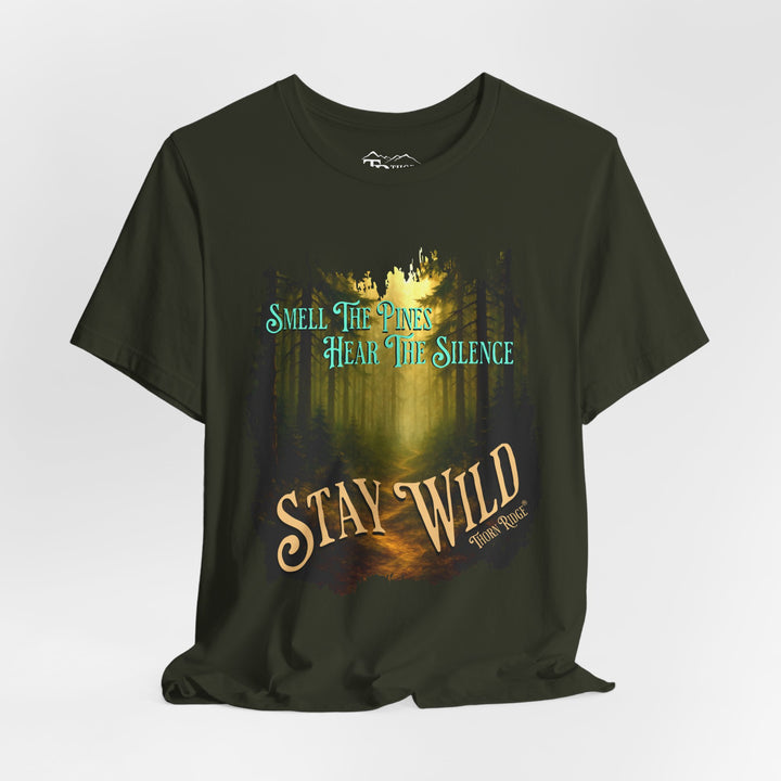 Smell The Pines Hear the Silence Stay Wild graphic tee with the image of a forest path and tall pines labeled Thorn Ridge®