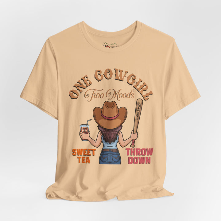 t-shirt with a graphic of a cowgirl holding a drink and a bat, with text 'One Cowgirl Two Moods Sweet Tea Throw Down' labeled Thorn Ridge®