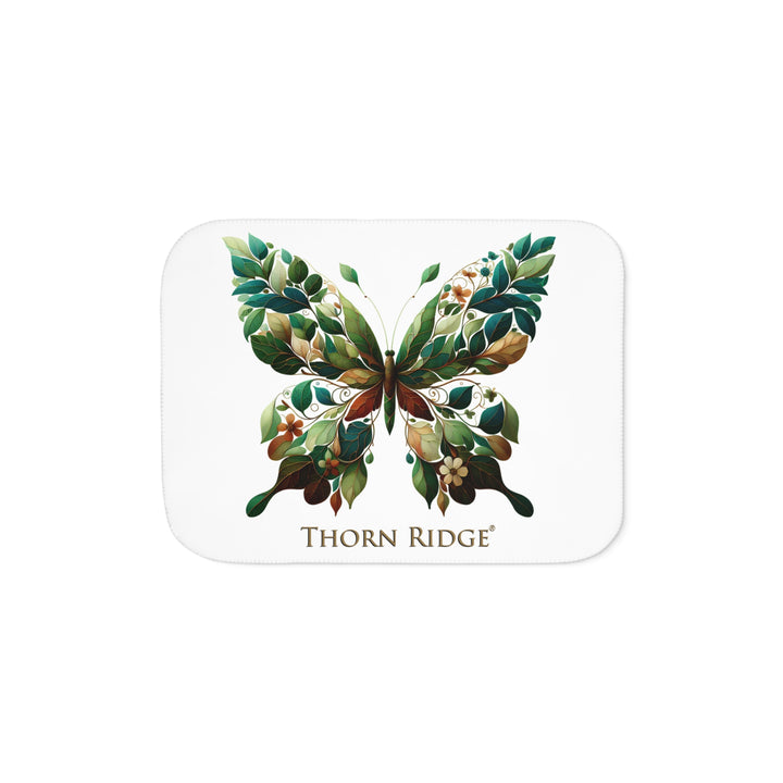 leaf Butterfly design on a white sherpa blanket with 'Thorn Ridge' branding