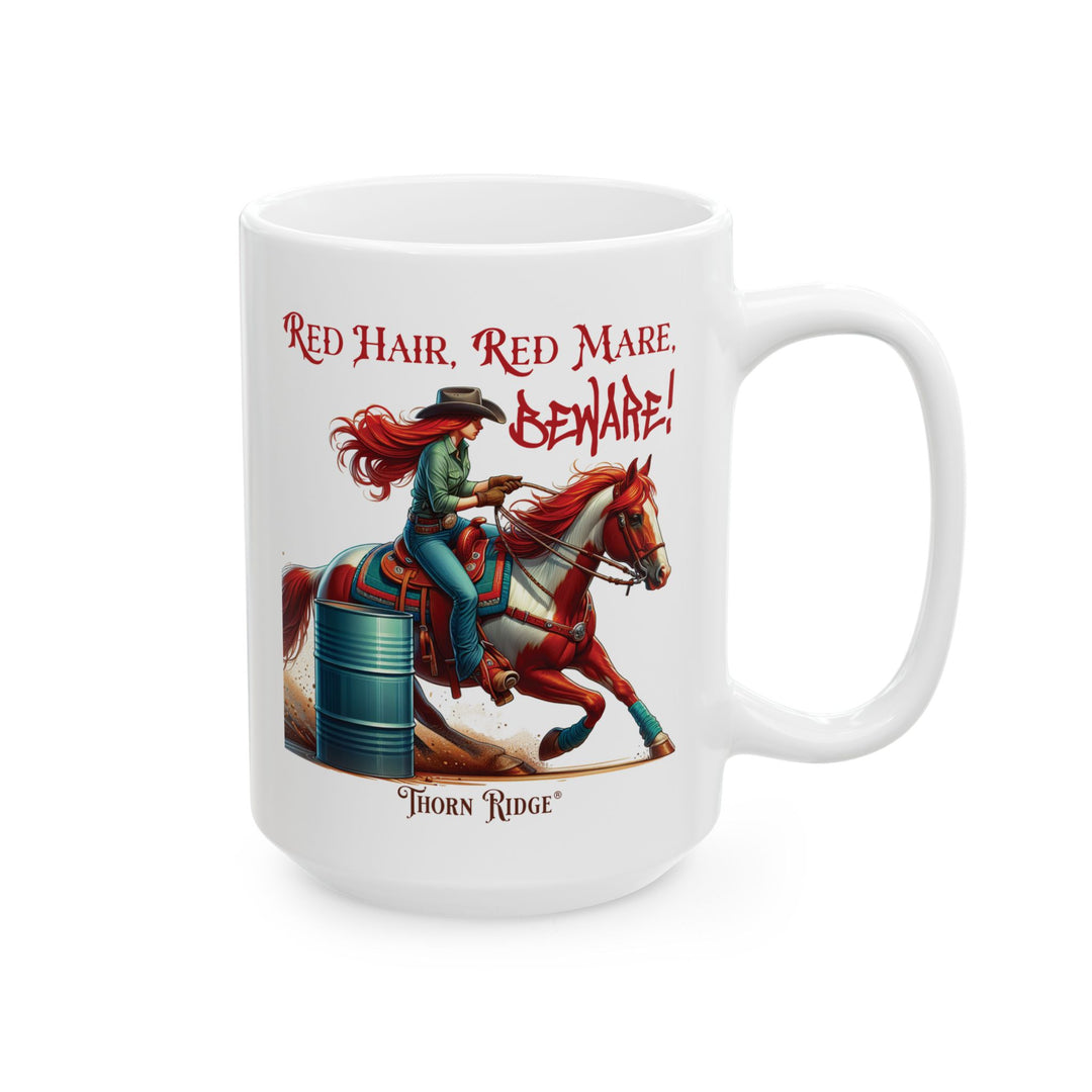 White mug with a graphic of a red haired woman on a chestnut mare and text 'Red Hair, Red Mare, Beware!' racing around a barrel by Thorn Ridge®