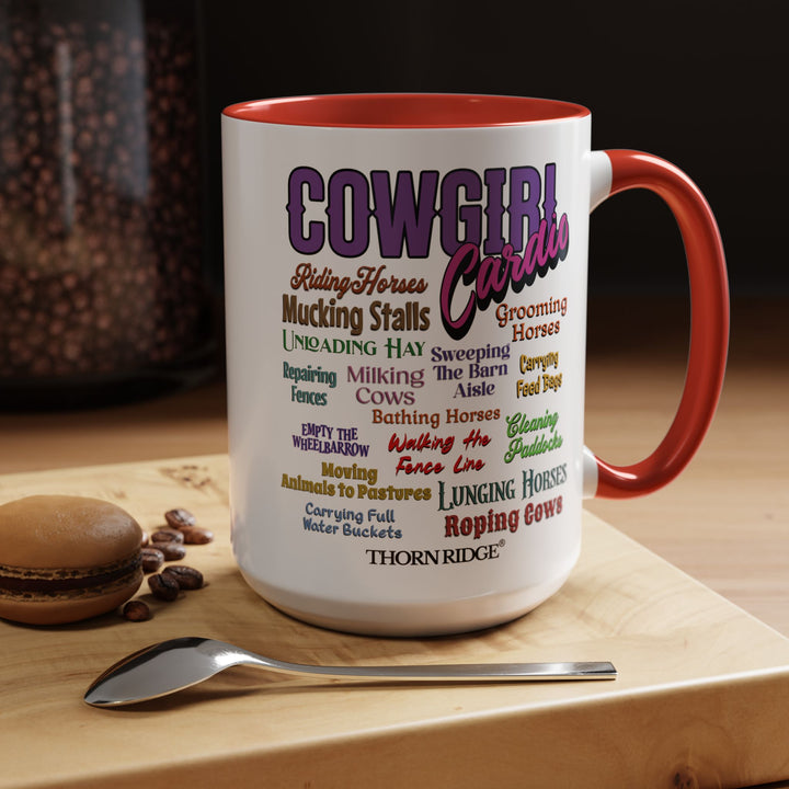 Mug with 'Cowgirl Cardio' text and red handle on a white background