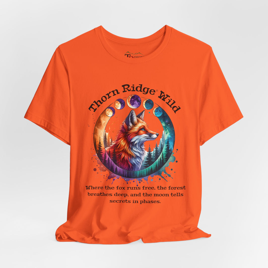 Thorn Ridge Wild Graphic Tee featuring a fox, forest, and moon phases. 