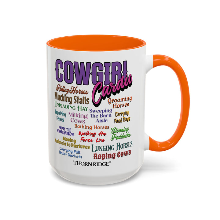 Mug with 'Cowgirl Cardio' text and orange handle on a white background