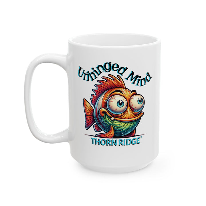 White mug with a colorful fish graphic and Unhinged Mind by Thorn Ridge®