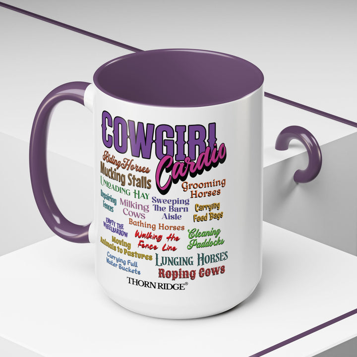 Mug with 'Cowgirl Cardio' text and purple handle on a white background