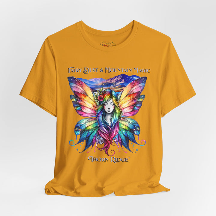 Fairy Dust and Mountain Magic graphic tee with a winged fairy in the front and mountains in the background labeled Thorn Ridge®