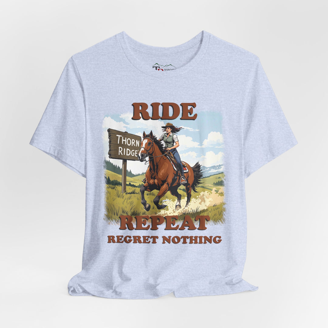 Ride Repeat Regret Nothing tee with a woman riding a galloping horse across the feild with the mountains in the background and a sign labeled Thorn Ridge®