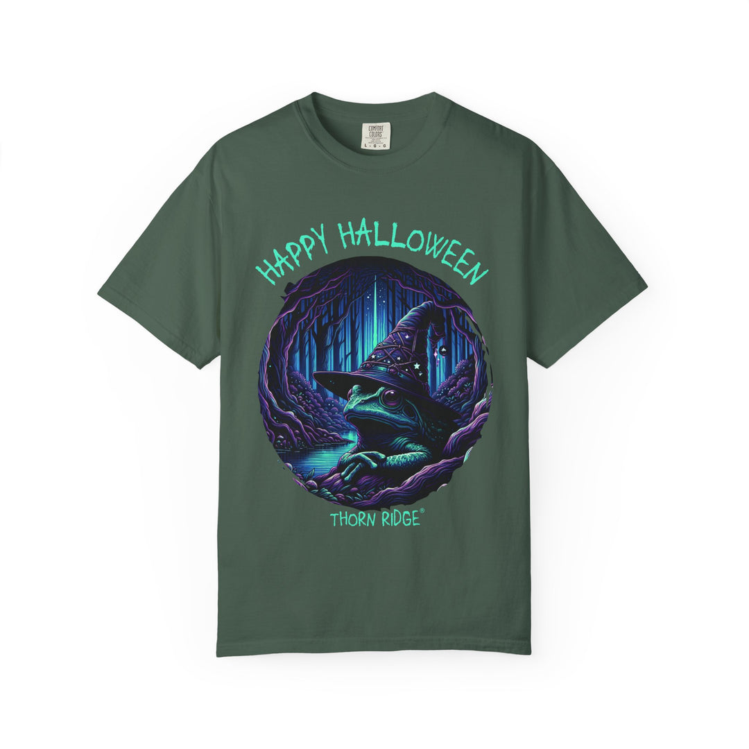 Happy Halloween from The Frog Witch labeled Thorn Ridge. Frog with a witches hat sitting by a dark stream in a wicked forest. 