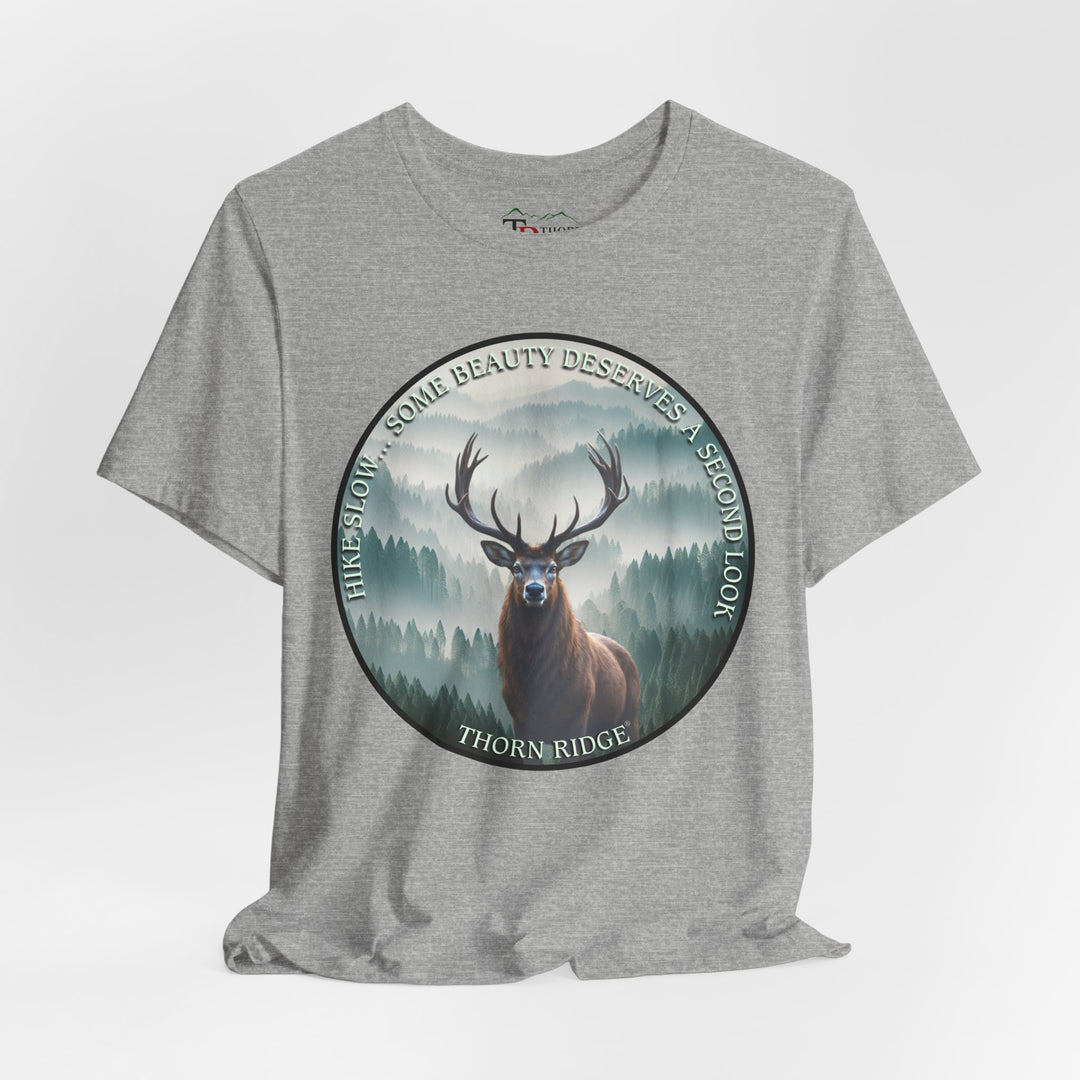 Hike Slow Some Beauty Deserves a Second Look tee with deer and mountains within a circular graphic by Thorn Ridge®