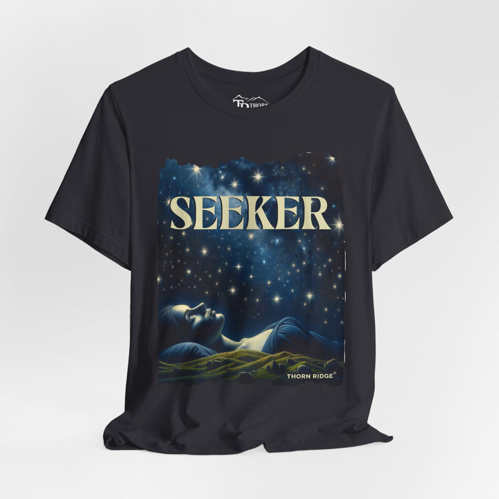 t-shirt labeled Seeker with the graphic of a woman laying on her back looking at the stars labeled Thorn Ridge®
