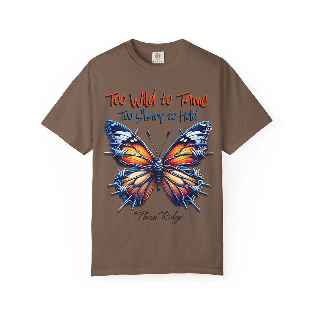 Too Wild To Tame Too Sharp To Hold Graphic Tee with a butterfly with barbed wire wings labeled Thorn Ridge. 