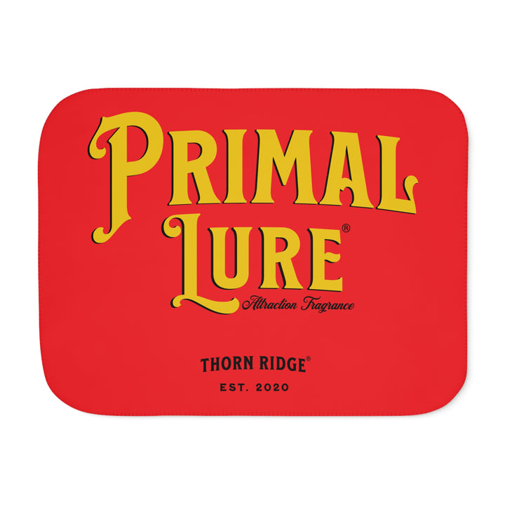 Prinmal Lure Attraction Fragrance by Thorn Ridge® in gold on a red sherpa blanket