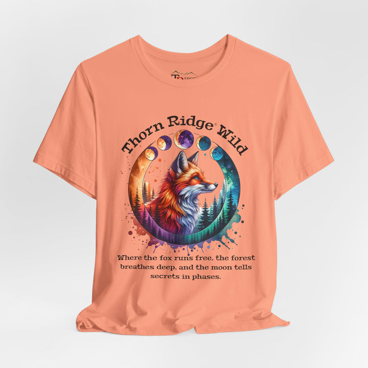 Thorn Ridge Wild Graphic Tee featuring a fox, forest, and moon phases. 