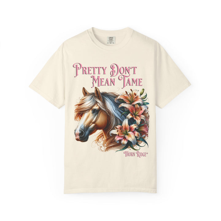 Pretty Don't Mean Tame graphic tee with a horse head and flowers branded to Thorn Ridge®