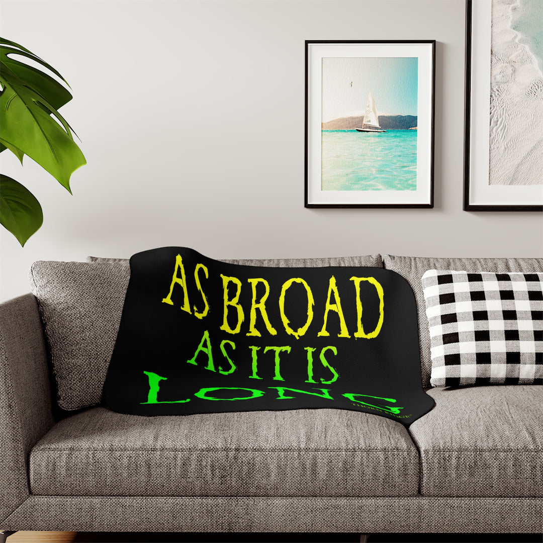 Black sherpa blanket with yellow and green text 'AS BROAD AS IT IS LONG' and 'THORN RIDGE' branding.