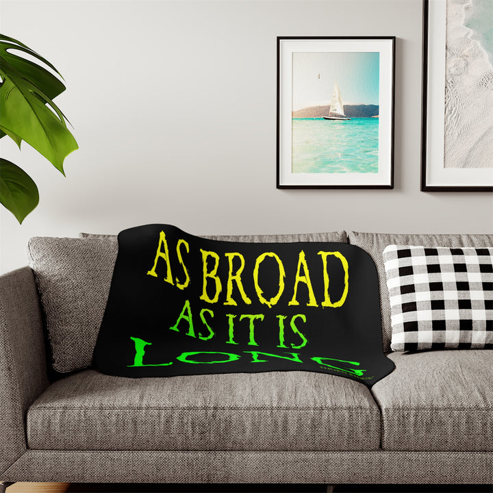 Black sherpa blanket with yellow and green text 'AS BROAD AS IT IS LONG' and 'THORN RIDGE' branding.