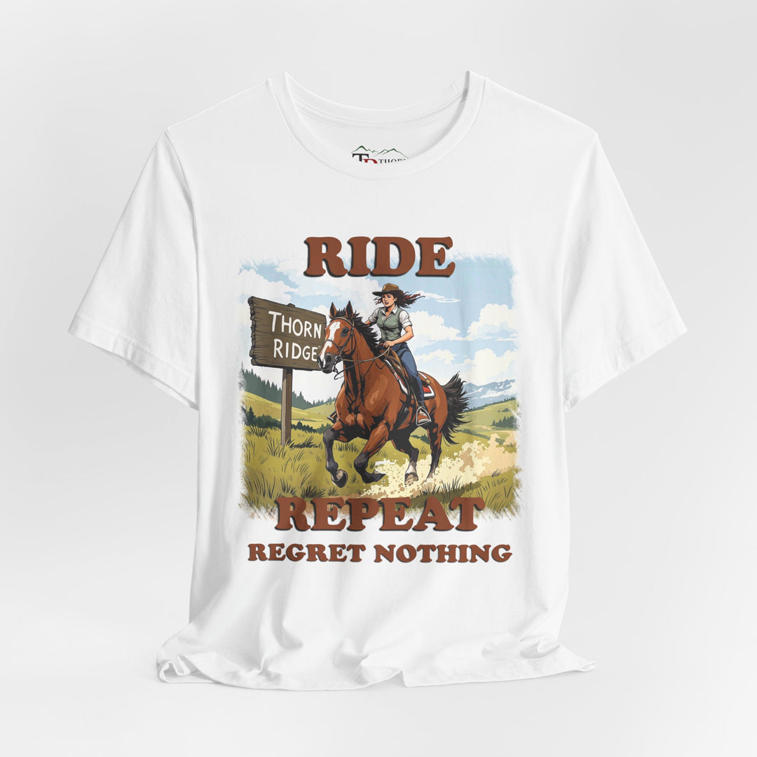 Ride Repeat Regret Nothing tee with a woman riding a galloping horse across the feild with the mountains in the background and a sign labeled Thorn Ridge®
