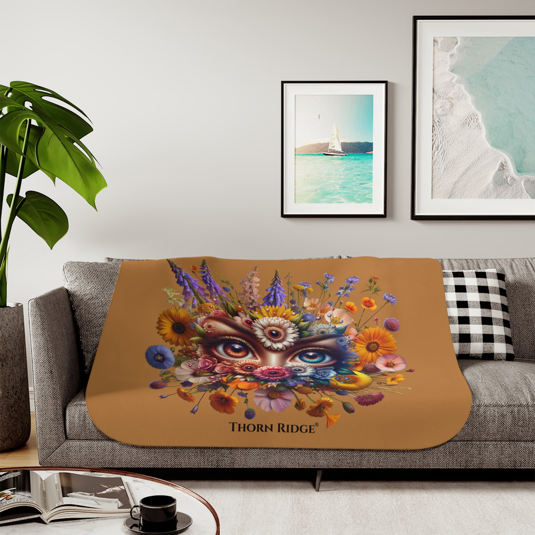 Colorful floral design with eyes on a brown background, featuring the brand 'Thorn Ridge'.