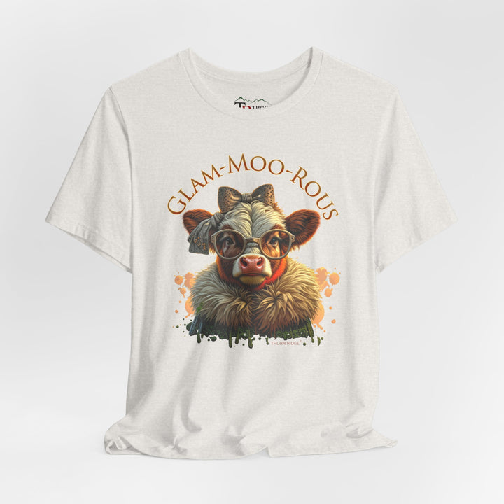 "Glam-Moo-Rous" Graphic Tee with a  Cow in brown tones with sunglasses and bows on her head and a boa around her neck. Labeled Thorn Ridge®
