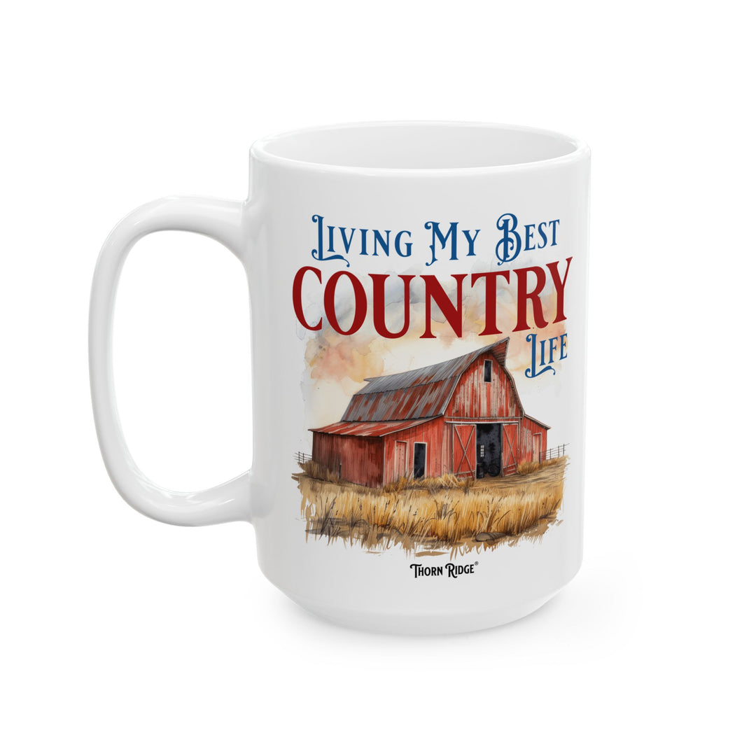 Mug with a red barn illustration and 'Living My Best Country Life' text on a white background with Thorn Ridge branding.