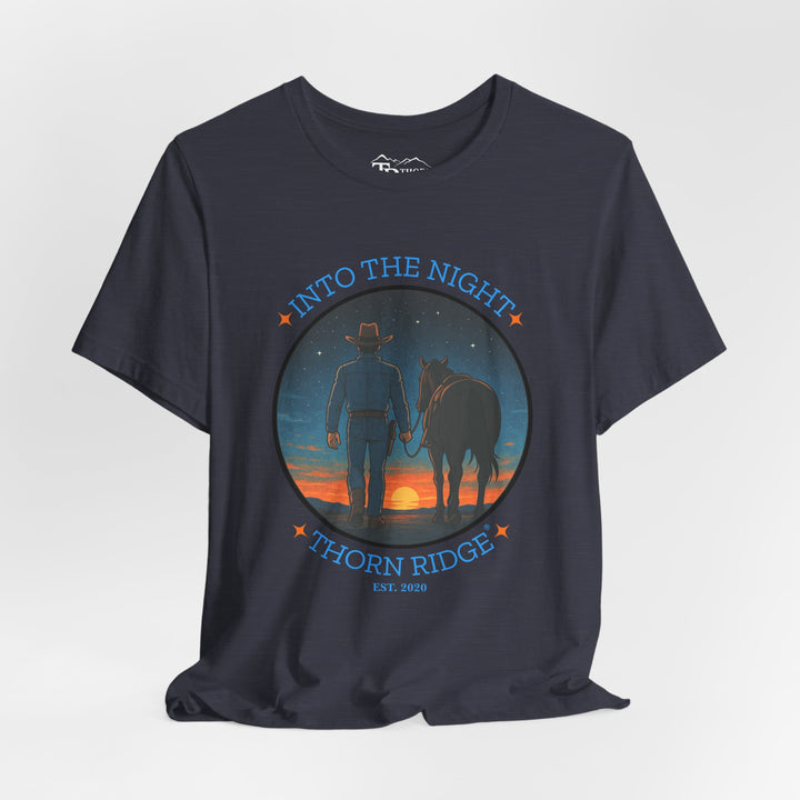 t-shirt with 'Into the Night' and 'Thorn Ridge' graphic design of a cowboy leading his horse into the setting sun as night is falling.