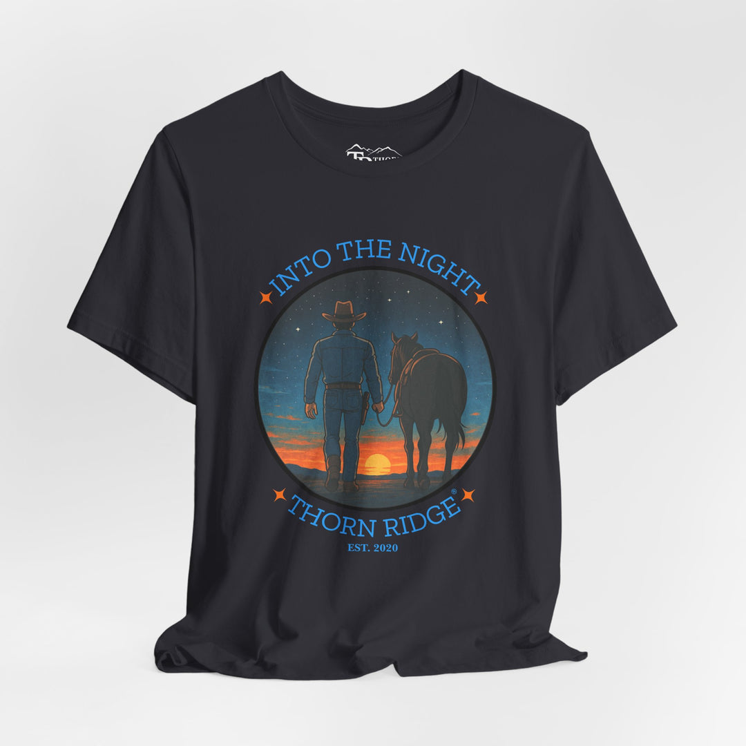 t-shirt with 'Into the Night' and 'Thorn Ridge' graphic design of a cowboy leading his horse into the setting sun as night is falling.