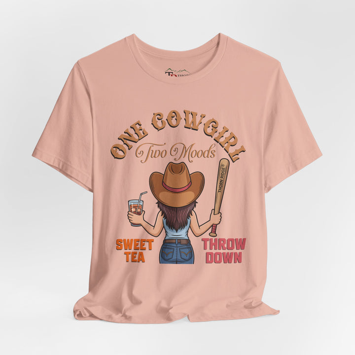 t-shirt with a graphic of a cowgirl holding a drink and a bat, with text 'One Cowgirl Two Moods Sweet Tea Throw Down' labeled Thorn Ridge®
