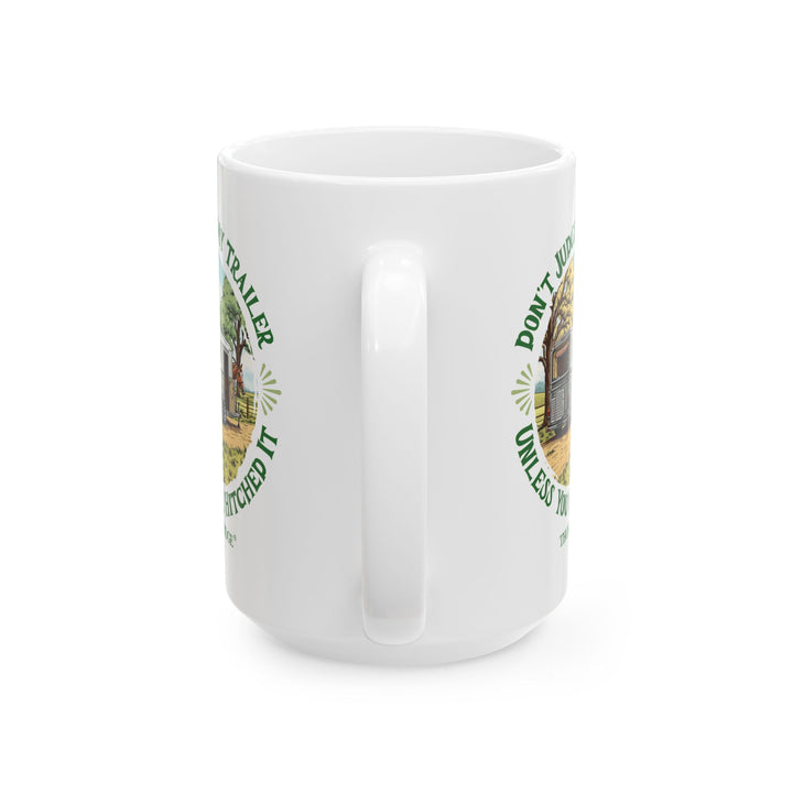 White mug with a graphic of a horse and horse trailer and text 'Don't Judge My Trailer Unless You've Hitched It' by Thorn Ridge®