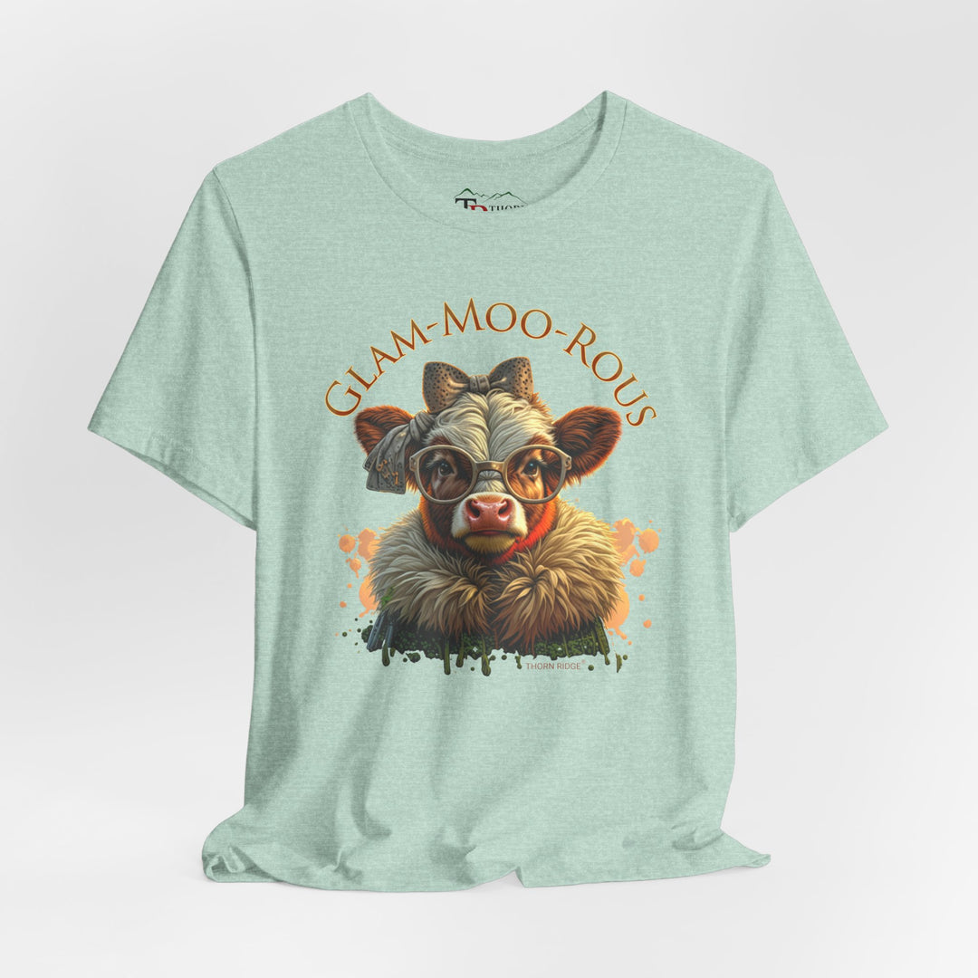 "Glam-Moo-Rous" Graphic Tee with a  Cow in brown tones with sunglasses and bows on her head and a boa around her neck. Labeled Thorn Ridge®